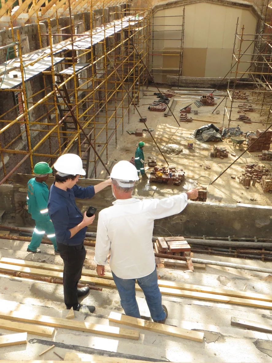 Contractor and engineer overseeing the construction of a commercial building.