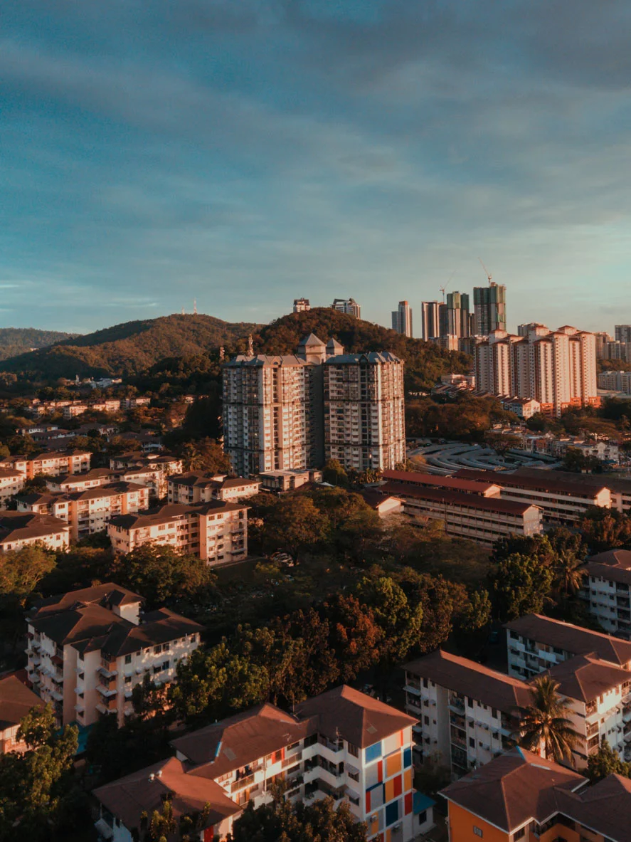 A suburban area in Malaysia with numerous high-rise apartments and condominiums in a cluster.